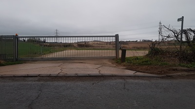 Gate, gap and council sign seen from slip road